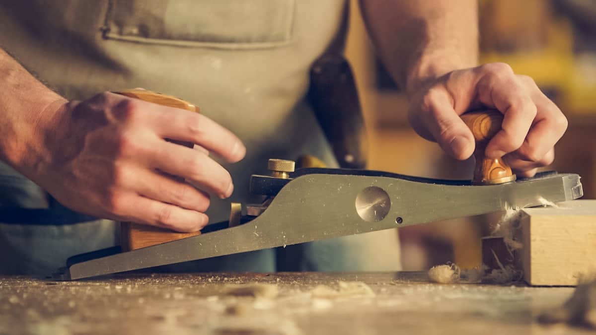 man hold wood planer image