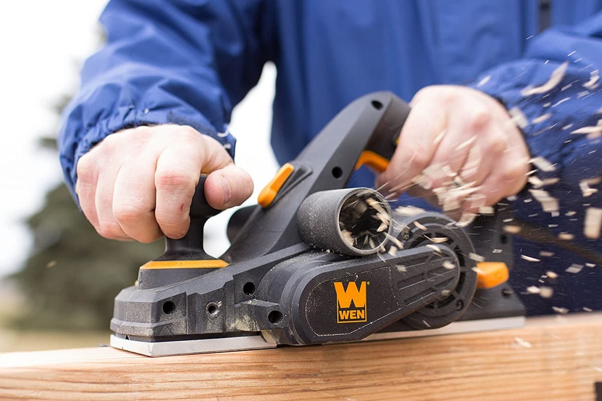 working with hand wood planer image