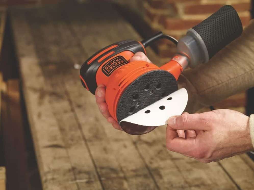 wood worker showing rotary sander bottom